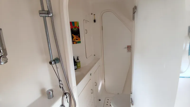 Slide: The Image of Interior of 2002 Voyage 440 yacht bathroom with shower and sink. - 23