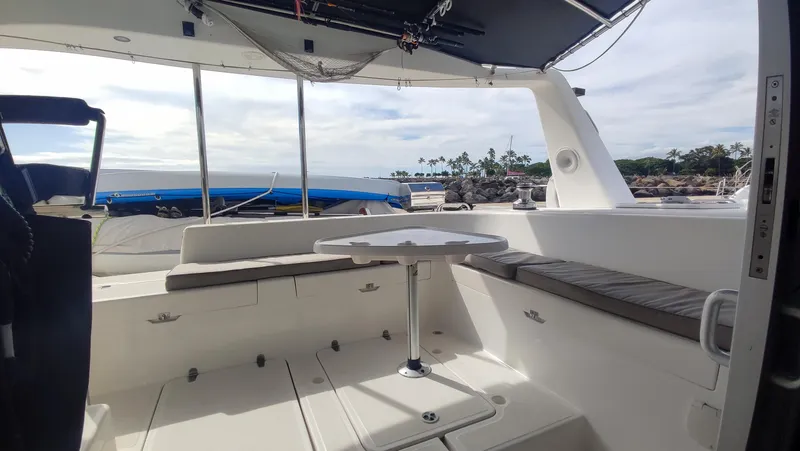 Slide: The Image of Spacious deck of 2002 Voyage 440 catamaran with seating and ocean view. - 7