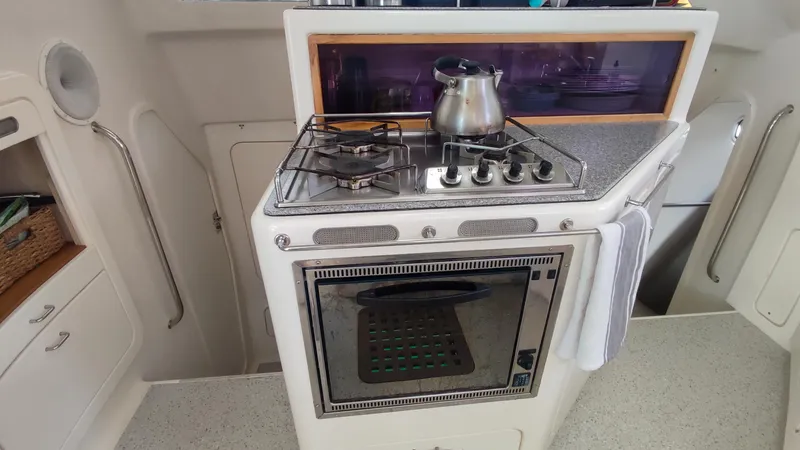 Slide: The Image of Voyage 440 yacht kitchen with stove and oven, 2002 model. - 8
