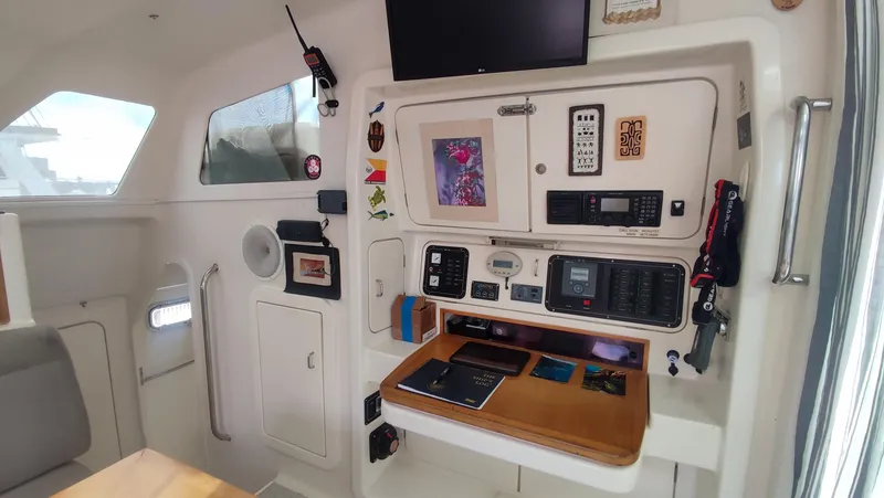 Slide: The Image of Voyage 440 yacht interior, 2002 model, featuring navigation equipment and control panel. - 9