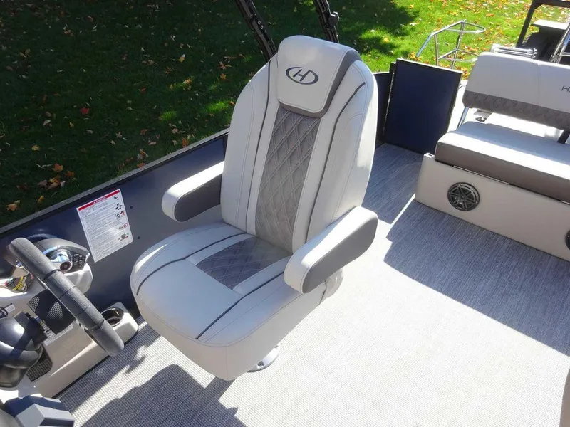 Slide: The Image of 2024 Harris Sunliner 230 Sport captain's chair with elegant design and comfortable seating. - 10