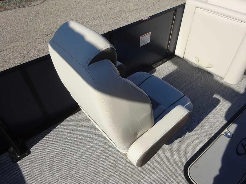 Slide: The Image of 2024 Harris Sunliner 230 Sport boat seat, gray upholstery, on deck. - 12