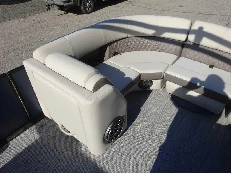 Slide: The Image of 2024 Harris Sunliner 230 Sport interior with plush seating and speaker system. - 15