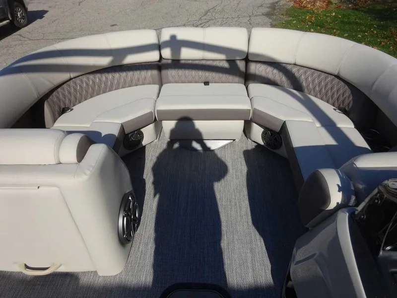Slide: The Image of 2024 Harris Sunliner 230 Sport boat interior with plush seating and modern design. - 5
