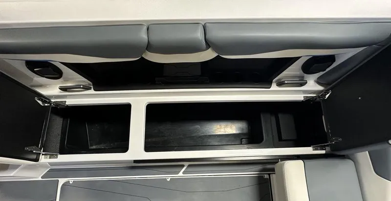 Slide: The Image of 2024 Axis T250 boat storage compartment with open hatches and seating. - 12