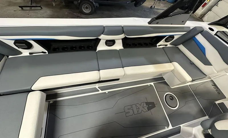 Slide: The Image of 2024 Axis T250 boat interior with gray and white seating and flooring. - 4