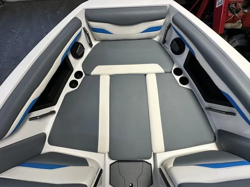 Slide: The Image of 2024 Axis T250 boat interior with gray and blue cushioned seating. - 9