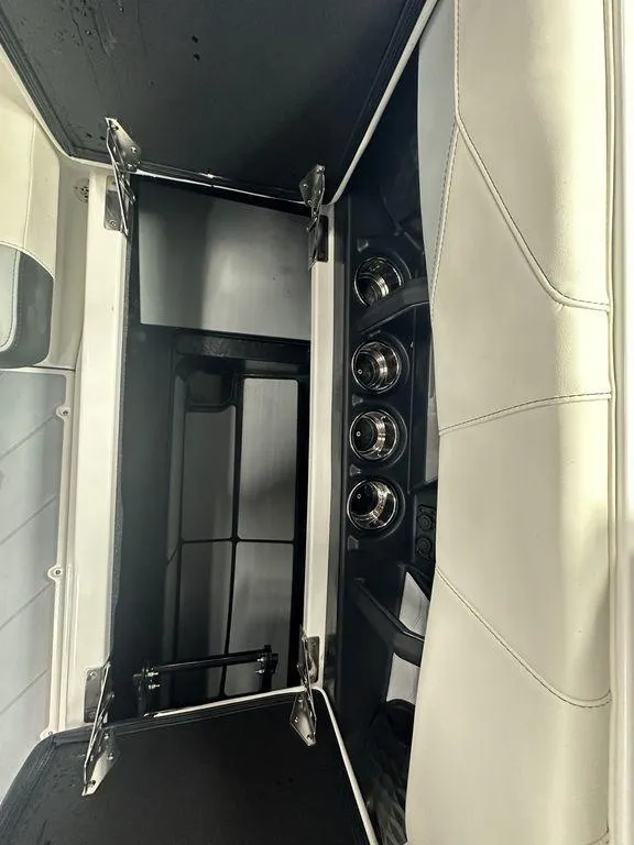 Slide: The Image of 2024 Malibu 23 LSV interior storage compartment with sleek design and modern features. - 14