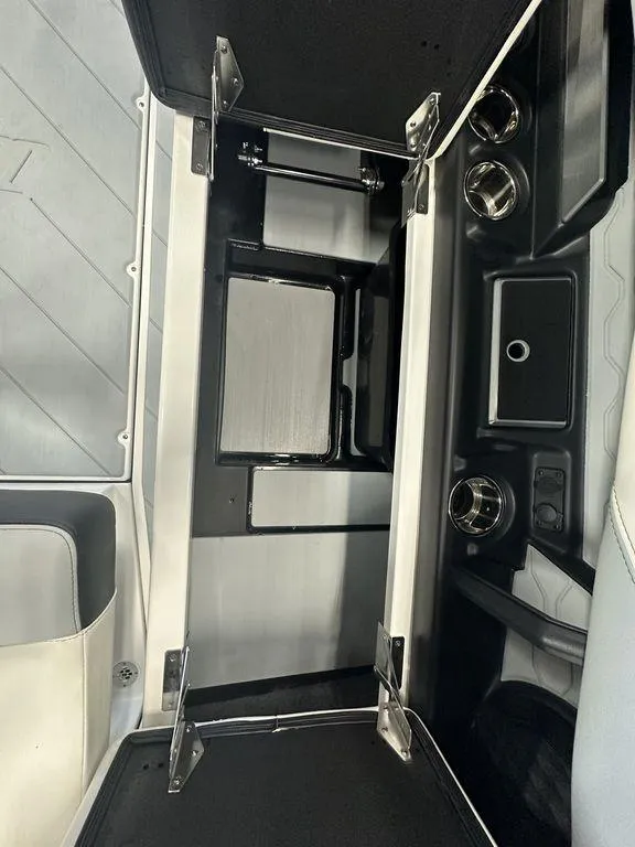 Slide: The Image of 2024 Malibu 23 LSV interior storage compartment with sleek design and modern features. - 16