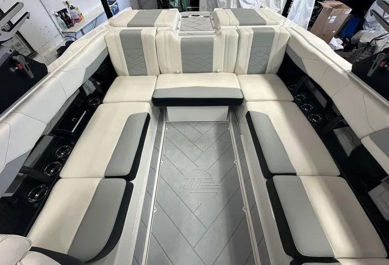 Slide: The Image of 2024 Malibu 23 LSV boat interior with luxurious seating and modern design. - 17