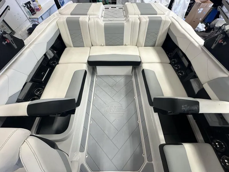 Slide: The Image of 2024 Malibu 23 LSV interior with luxurious seating and modern design. - 18