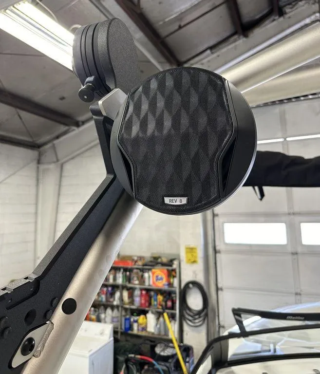 Slide: The Image of 2024 Malibu 23 LSV boat speaker in a garage setting. - 21