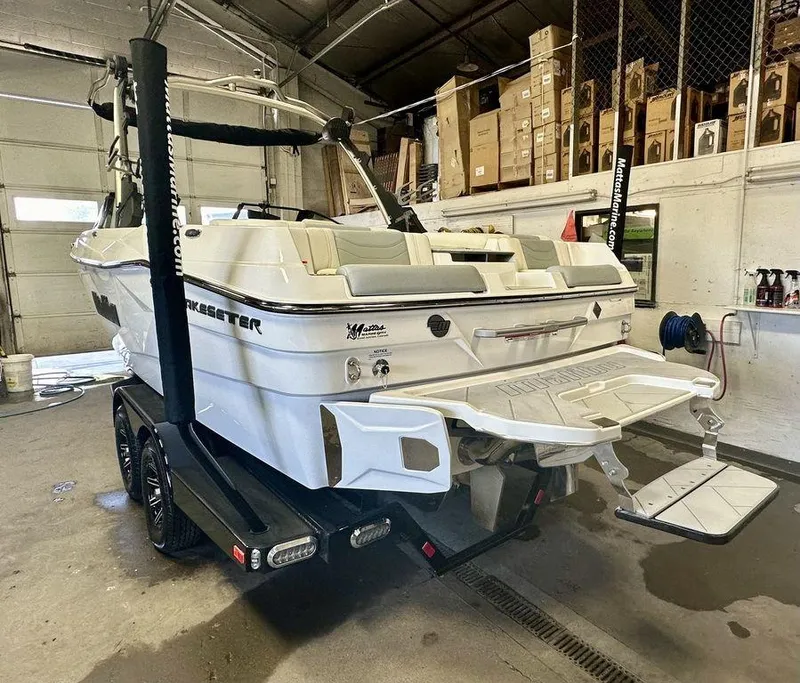 Slide: The Image of 2024 Malibu 23 LSV boat in a garage, rear view on trailer. - 7