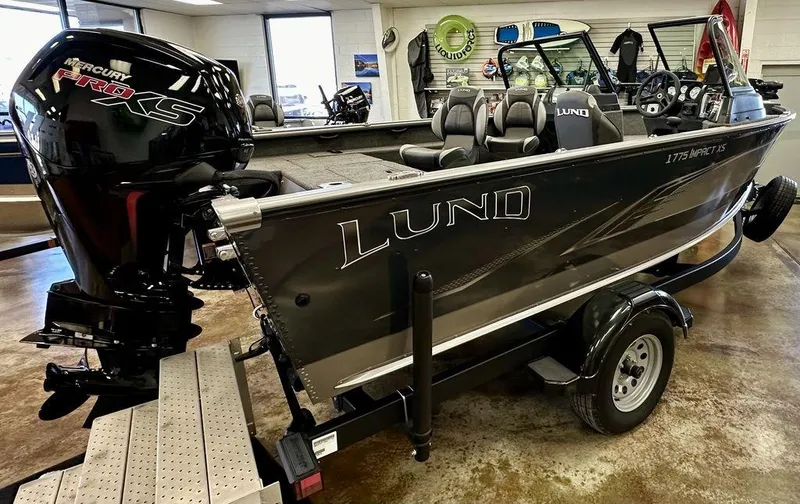 Slide: The Image of 2024 Lund 1775 Impact XS Sport fishing boat on trailer in showroom. - 10