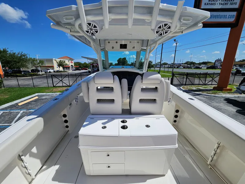 Slide: The Image of 2024 Sailfish 312CC center console boat interior with seating and storage. - 14