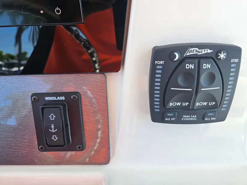 Slide: The Image of Control panel of a 2024 Sailfish 312CC boat with windlass and trim tab controls. - 26