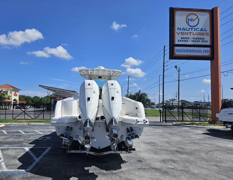 Slide: The Image of 2024 Sailfish 312CC boat at Nautical Ventures dealership. - 4