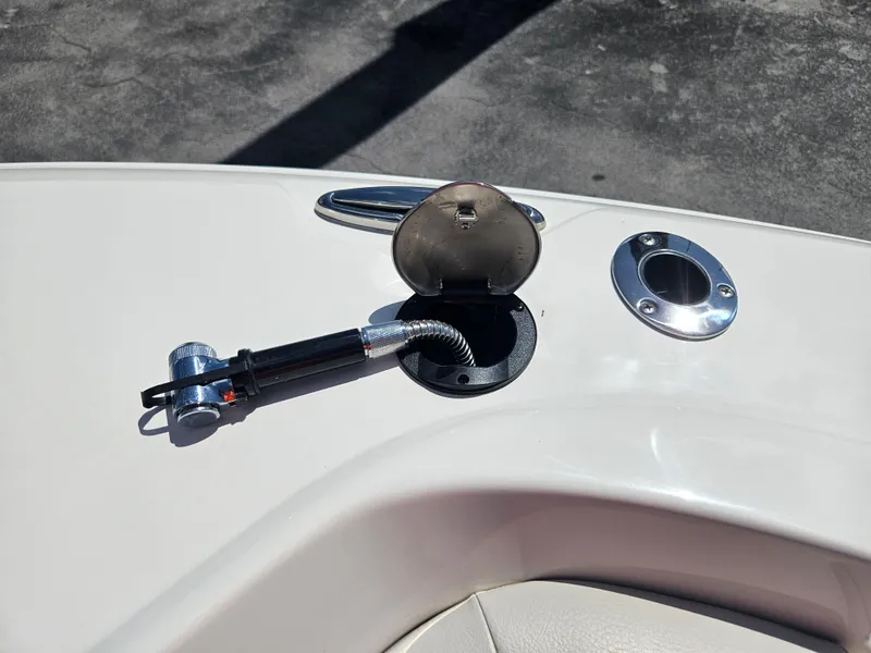 Slide: The Image of 2024 Sailfish 312CC boat deck with fuel filler cap and hose. - 41