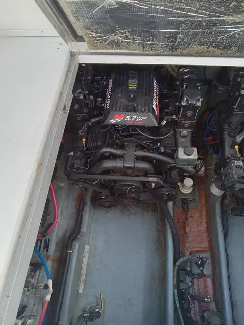 Slide: The Image of Engine compartment of a 2001 Sea Ray 290 Amberjack boat. - 11