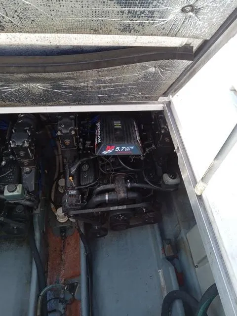 Slide: The Image of Engine compartment of a 2001 Sea Ray 290 Amberjack boat with 5.7L engine. - 12
