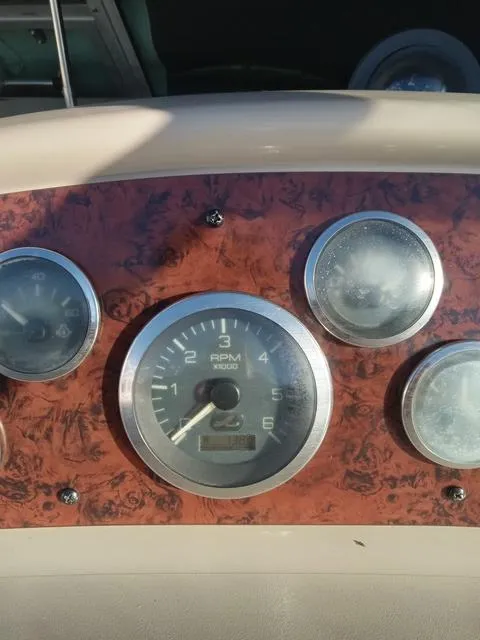 Slide: The Image of Close-up of 2001 Sea Ray 290 Amberjack boat dashboard gauges. - 13