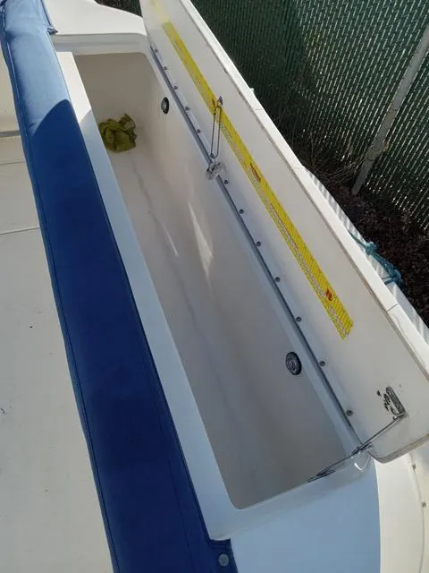 Slide: The Image of Open storage compartment on a 2001 Sea Ray 290 Amberjack boat. - 16