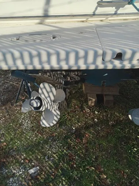 Slide: The Image of 2001 Sea Ray 290 Amberjack boat propeller and stern on land. - 19