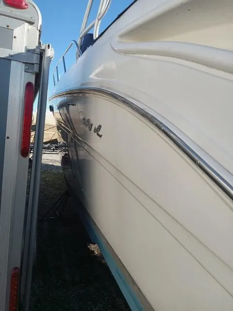 Slide: The Image of 2001 Sea Ray 290 Amberjack boat side view in storage. - 21