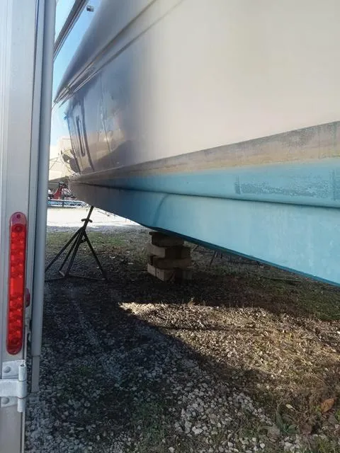 Slide: The Image of 2001 Sea Ray 290 Amberjack boat hull on dry dock. - 22