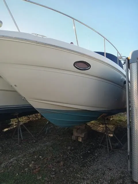 Slide: The Image of 2001 Sea Ray 290 Amberjack boat on stands, side view. - 23