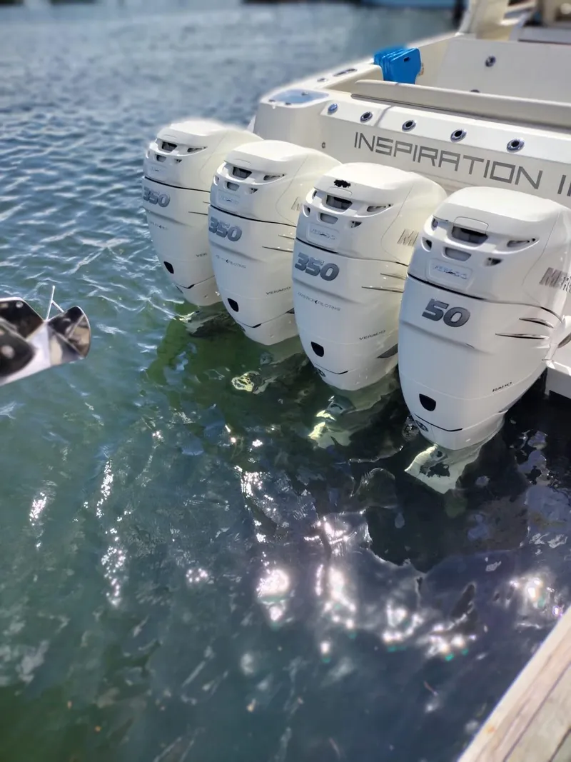 Slide: The Image of 2018 Boston Whaler 420 Outrage with four powerful outboard engines on water. - 10