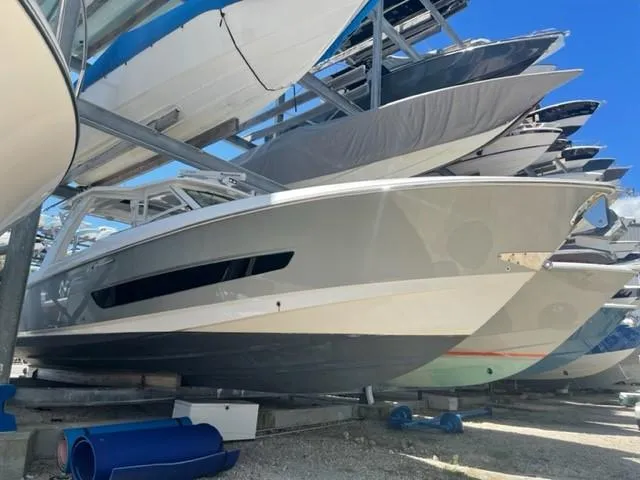 Slide: The Image of 2018 Boston Whaler 420 Outrage boat stored in a dry dock facility. - 2