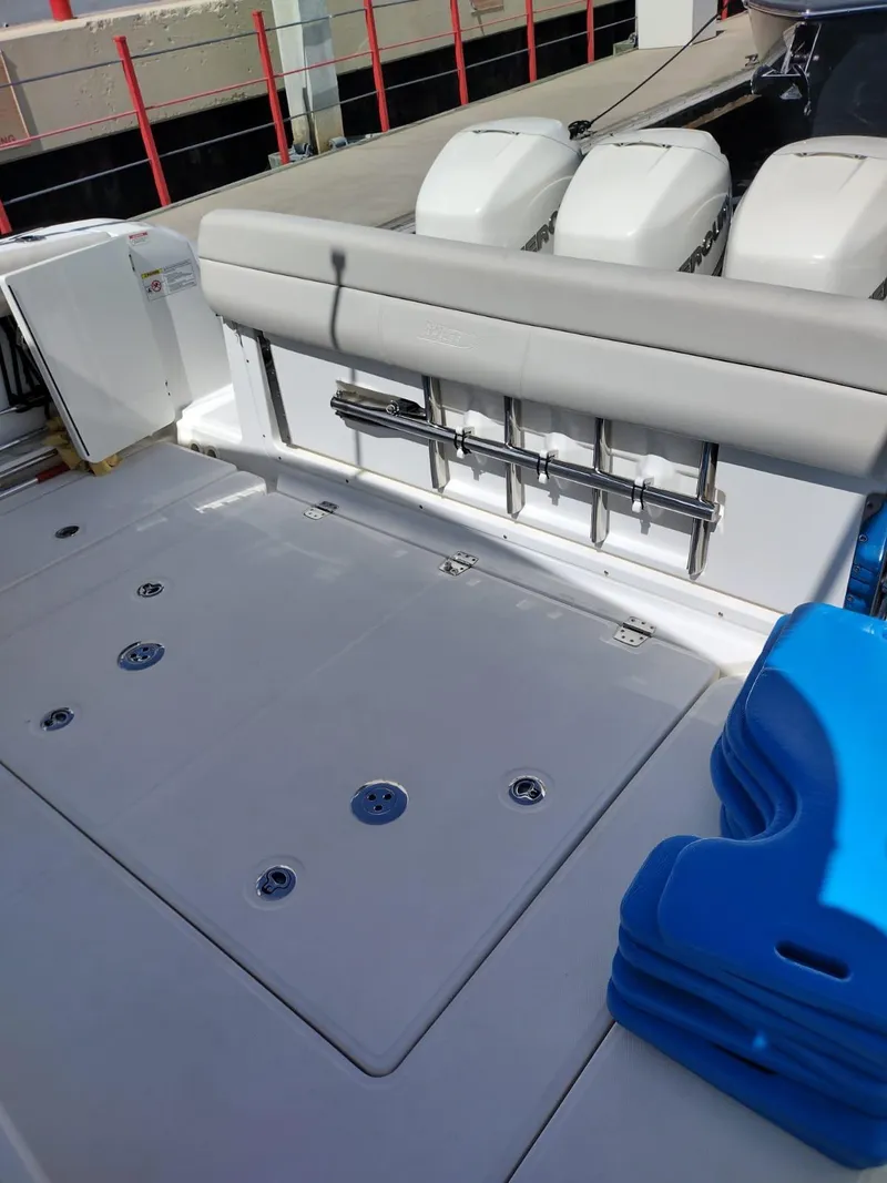 Slide: The Image of 2018 Boston Whaler 420 Outrage boat deck with seating and engine view. - 24