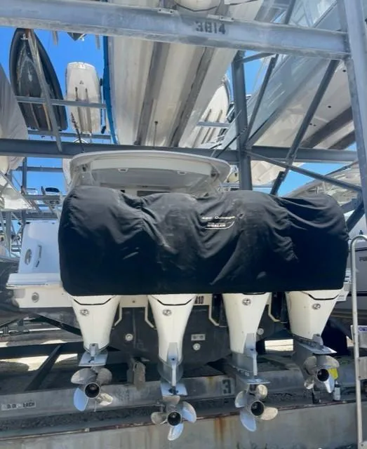 Slide: The Image of 2018 Boston Whaler 420 Outrage with covered engines in storage. - 3