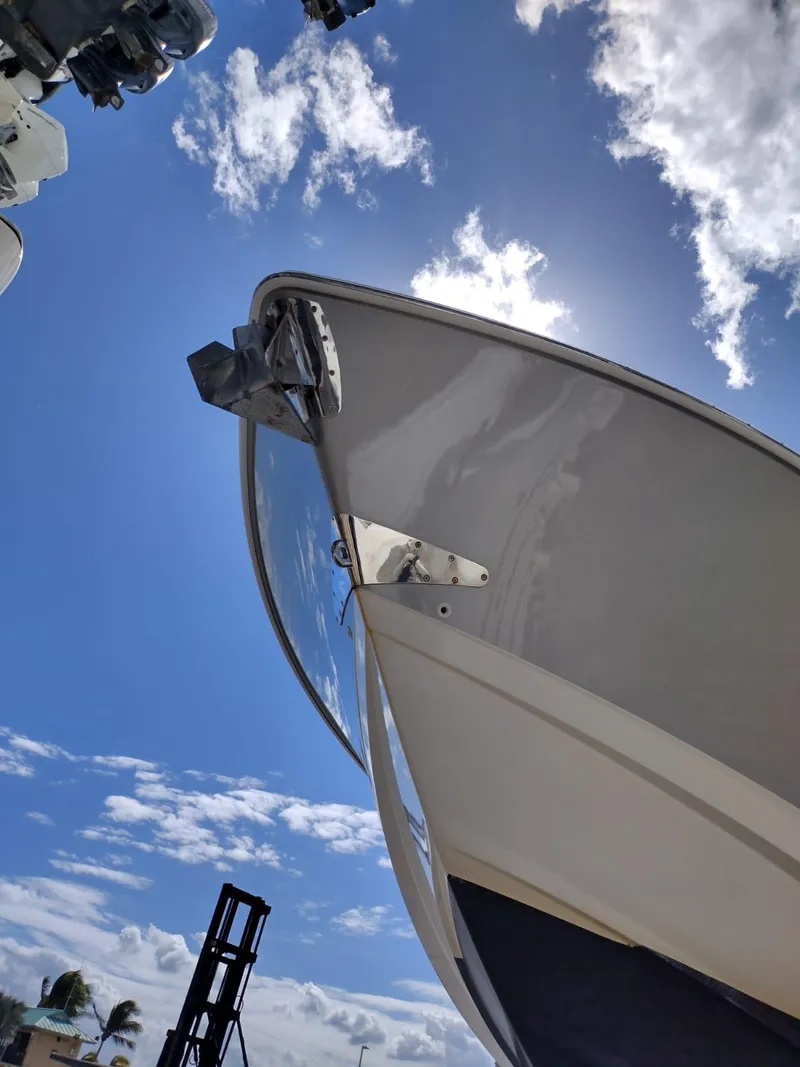 Slide: The Image of 2018 Boston Whaler 420 Outrage boat under clear blue sky with clouds. - 30