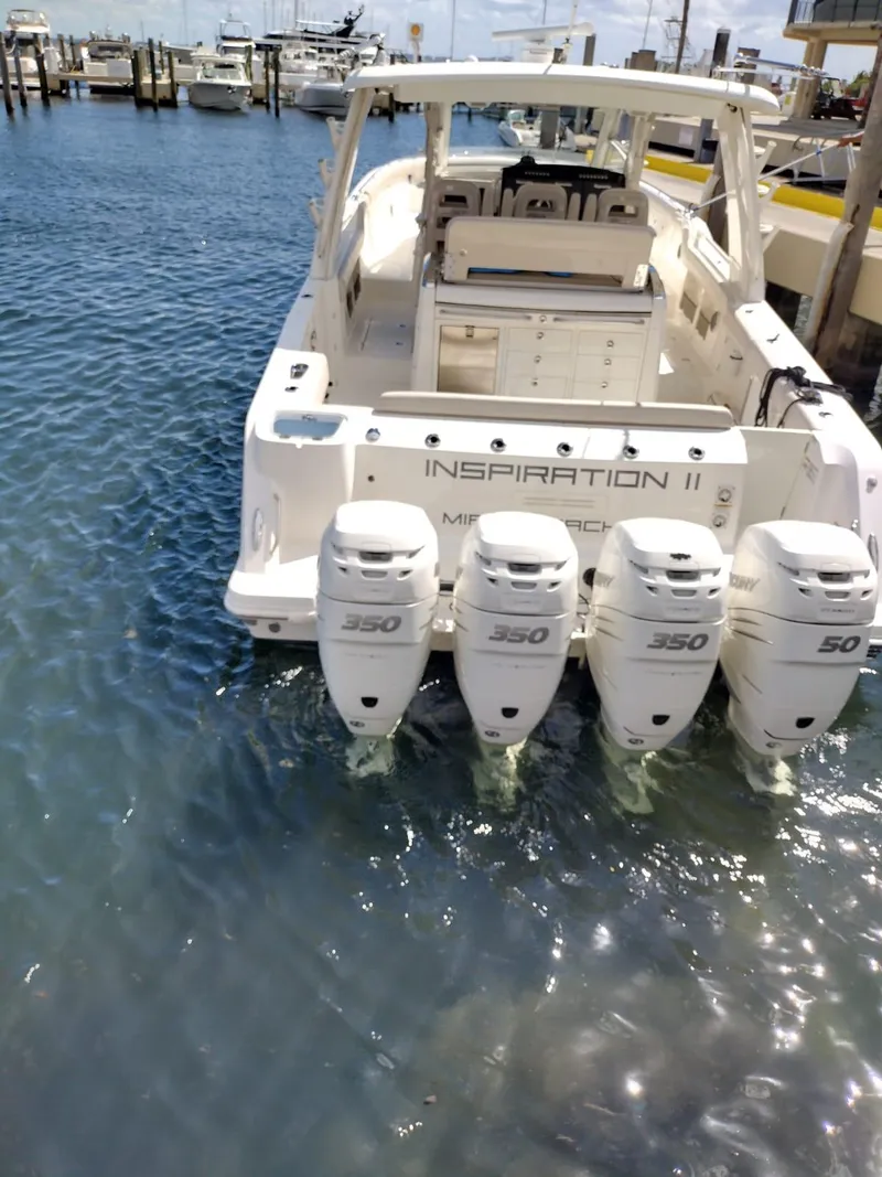 Slide: The Image of 2018 Boston Whaler 420 Outrage with four 350 HP engines docked at marina. - 36