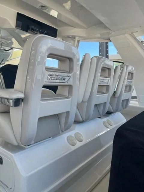 Slide: The Image of 2018 Boston Whaler 420 Outrage interior with sleek, modern seating design. - 4