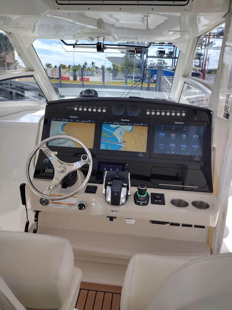 Slide: The Image of 2018 Boston Whaler 420 Outrage helm with advanced navigation displays and controls. - 44