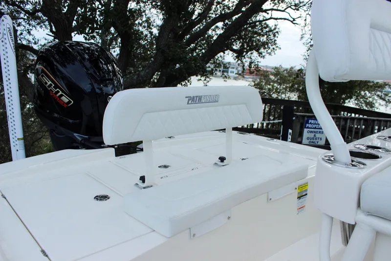 Slide: The Image of 2024 Pathfinder 2300 HPS boat with white seating and powerful outboard motor. - 4
