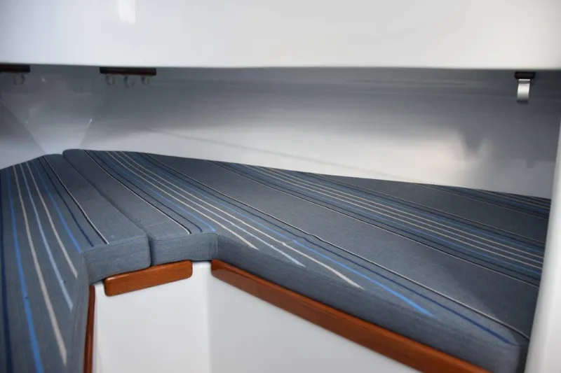 Slide: The Image of V-Berth cushions with storage beneath - 16