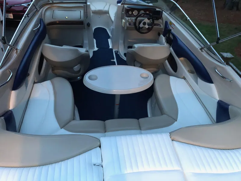 Slide: The Image of 2005 Glastron GX 235 boat interior with seating and table. - 4