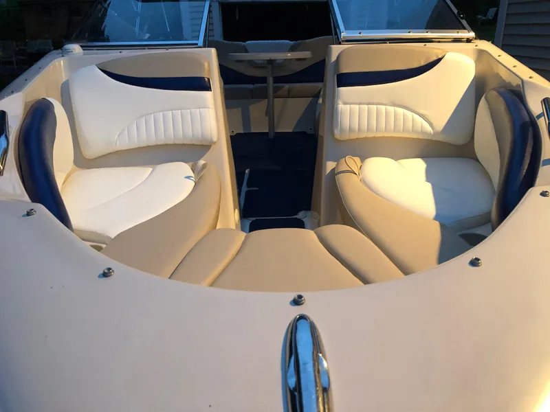 Slide: The Image of 2005 Glastron GX 235 boat interior with white and beige seating. - 5