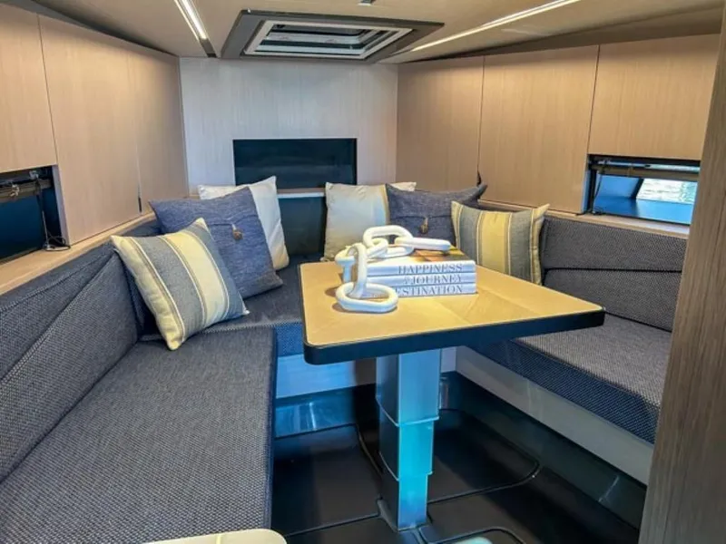 Slide: The Image of Interior of 2024 Windy 40 Camira SX yacht with cozy seating and table. - 12