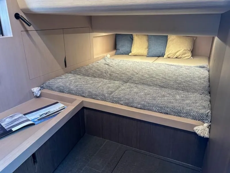 Slide: The Image of 2024 Windy 40 Camira SX cabin interior with cozy bed and reading nook. - 14