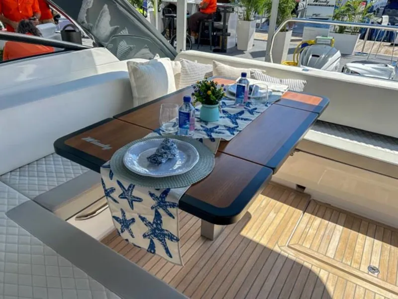 Slide: The Image of Elegant dining setup on the 2024 Windy 40 Camira SX yacht. - 18