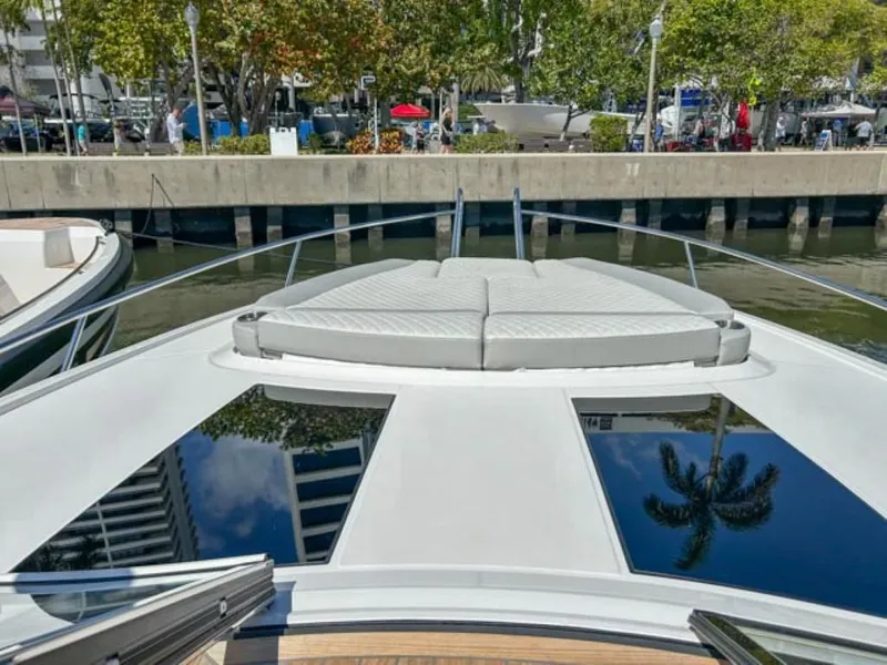 Slide: The Image of 2024 Windy 40 Camira SX luxury yacht with sunbathing area docked at marina. - 5