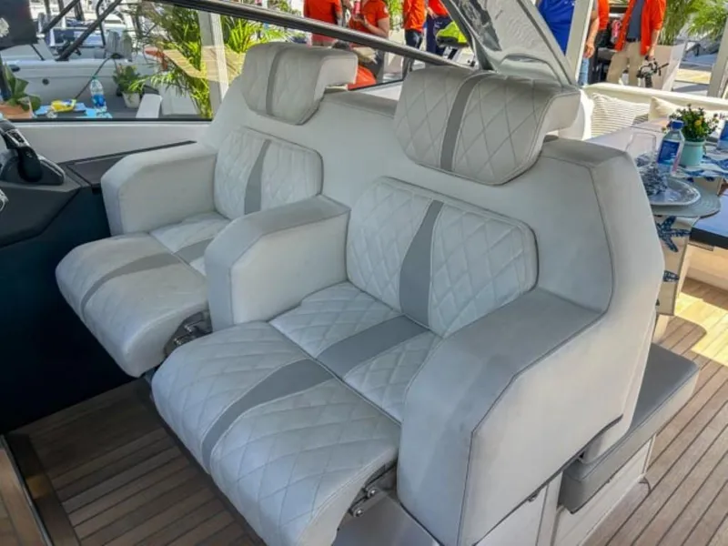 Slide: The Image of Luxurious seating on the 2024 Windy 40 Camira SX yacht, featuring plush white upholstery. - 8