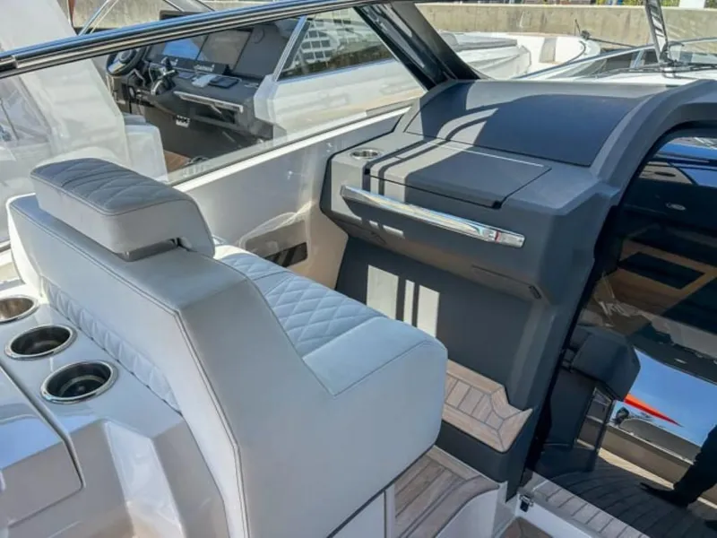 Slide: The Image of Interior of 2024 Windy 40 Camira SX luxury yacht with white leather seating. - 9