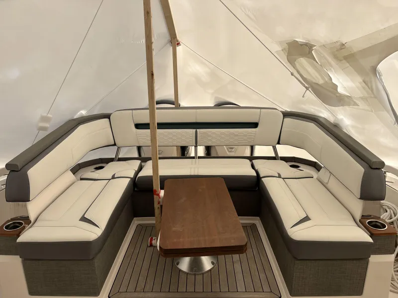 Slide: The Image of Luxurious seating area on a 2019 Tiara Sport 38 yacht with elegant wood table. - 22