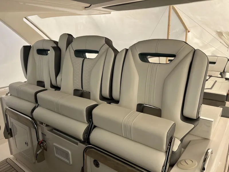Slide: The Image of Luxurious seating on a 2019 Tiara Sport 38 yacht, featuring plush, modern design. - 23